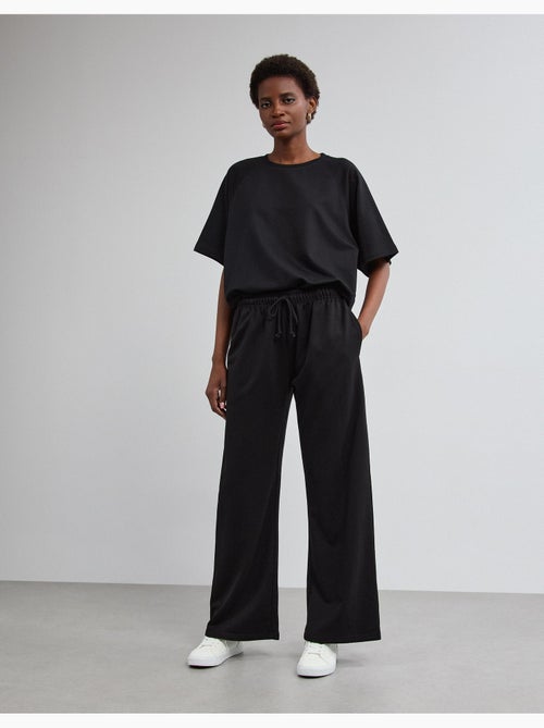 Pantalones de chándal de pierna ancha, mo fashion - Kiabi Pantalones de chándal de pierna ancha, mo fashion - Kiabi