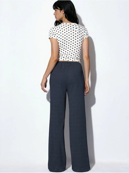 Pantalones de chándal de rayas de pernera recta busem - Kiabi Pantalones de chándal de rayas de pernera recta busem - Kiabi