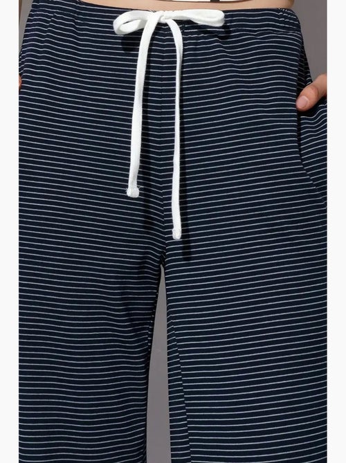 Pantalones de chándal de rayas de pernera recta busem - Kiabi Pantalones de chándal de rayas de pernera recta busem - Kiabi