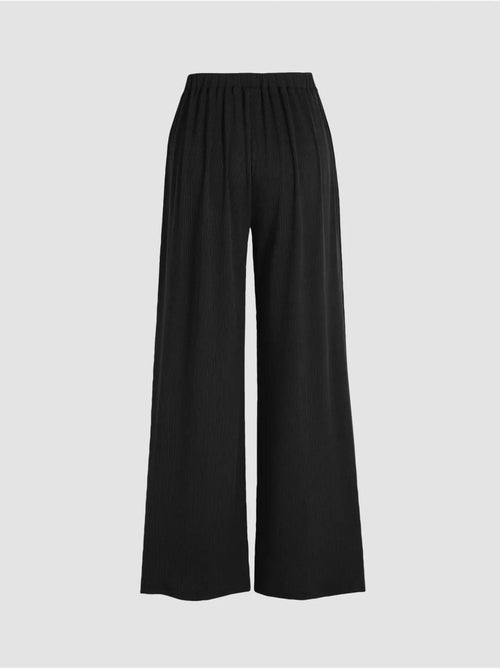 Pantalones de cintura elástica y pierna ancha - Kiabi Pantalones de cintura elástica y pierna ancha - Kiabi