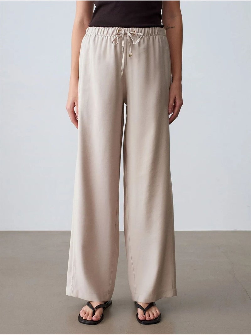 Pantalones de pernera ancha con cintura elástica y cordón ajustable dilvin Arena - Kiabi