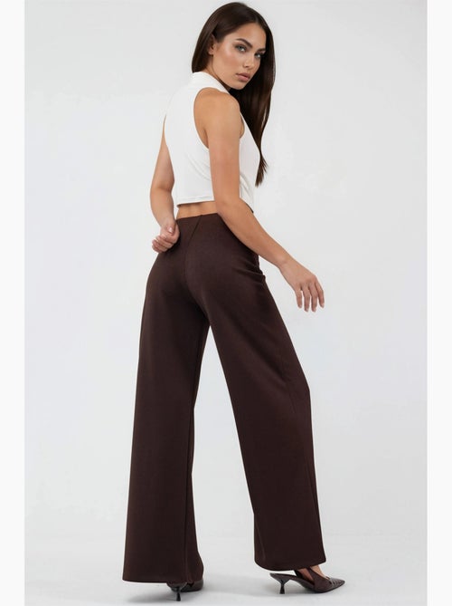 Pantalones de pernera ancha de talle alto busem - Kiabi Pantalones de pernera ancha de talle alto busem - Kiabi