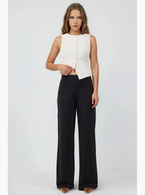 Pantalones de pernera ancha de talle alto busem - Kiabi Pantalones de pernera ancha de talle alto busem - Kiabi