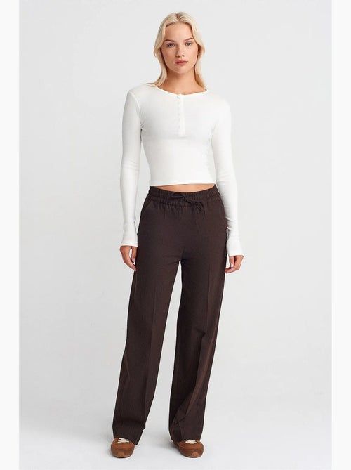 Pantalones de pernera ancha pull-on dilvin - Kiabi Pantalones de pernera ancha pull-on dilvin - Kiabi