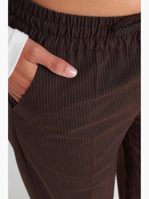 Pantalones de pernera ancha pull-on dilvin - Kiabi Pantalones de pernera ancha pull-on dilvin - Kiabi
