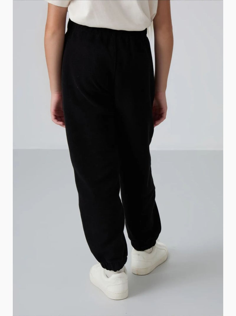 Pantalones de poliéster para jóvenes tommy Negro - Kiabi