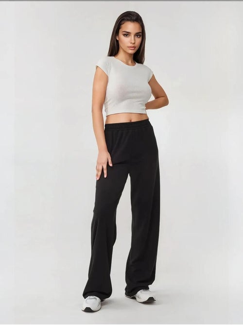 Pantalones de punto de pierna ancha con cintura elástica - Kiabi Pantalones de punto de pierna ancha con cintura elástica - Kiabi