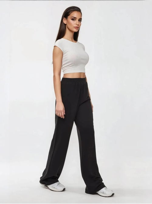 Pantalones de punto de pierna ancha con cintura elástica - Kiabi Pantalones de punto de pierna ancha con cintura elástica - Kiabi