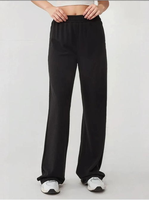 Pantalones de punto de pierna ancha con cintura elástica - Kiabi Pantalones de punto de pierna ancha con cintura elástica - Kiabi