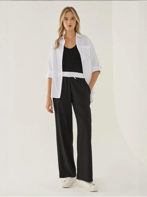 Pantalones de rayas con cintura elástica - Kiabi Pantalones de rayas con cintura elástica - Kiabi