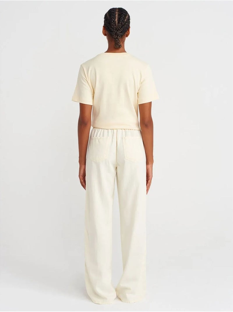 Pantalones de tiro alto y pernera ancha con cintura para anudar dilvin Crema - Kiabi