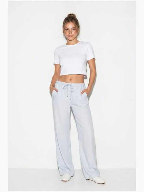 Pantalones de verano de lyocell con cintura elástica y detalle de bolsillo de bianco lucci - Kiabi Pantalones de verano de lyocell con cintura elástica y detalle de bolsillo de bianco lucci - Kiabi