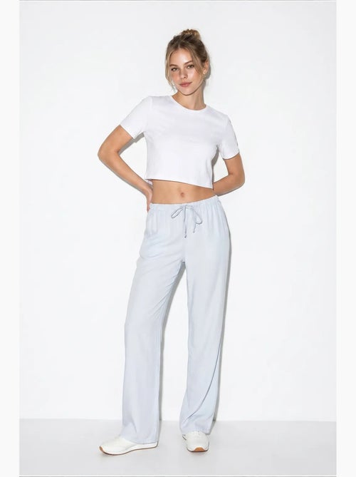 Pantalones de verano de lyocell con cintura elástica y detalle de bolsillo de bianco lucci - Kiabi Pantalones de verano de lyocell con cintura elástica y detalle de bolsillo de bianco lucci - Kiabi