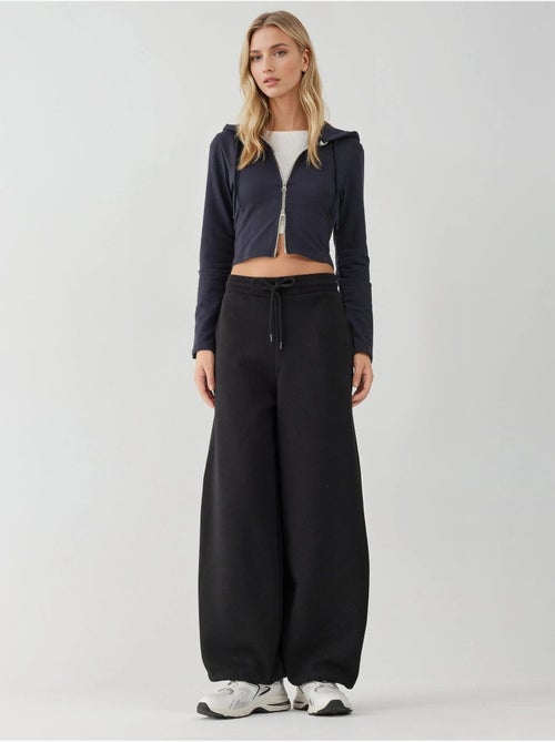 Pantalones deportivos básicos con realce y corte barril hiccup - Kiabi Pantalones deportivos básicos con realce y corte barril hiccup - Kiabi