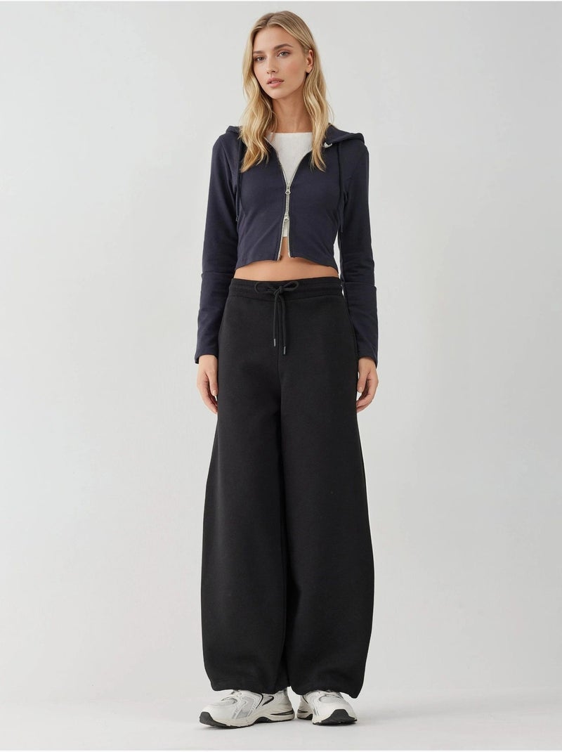 Pantalones deportivos básicos con realce y corte barril hiccup Negro - Kiabi