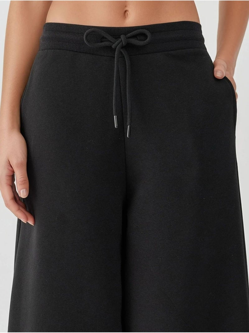 Pantalones deportivos básicos con realce y corte barril hiccup Negro - Kiabi