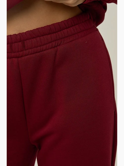 Pantalones deportivos de pierna ancha con cintura y cordón ajustable hiccup - Kiabi Pantalones deportivos de pierna ancha con cintura y cordón ajustable hiccup - Kiabi