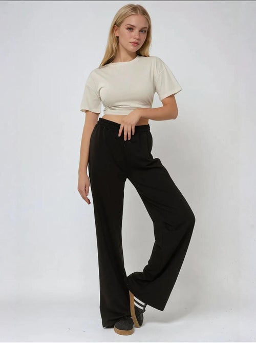 Pantalones deportivos elásticos de pierna ancha hiccup - Kiabi Pantalones deportivos elásticos de pierna ancha hiccup - Kiabi