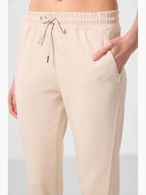 Pantalones jogger de mujer con cremallera tommy - Kiabi Pantalones jogger de mujer con cremallera tommy - Kiabi