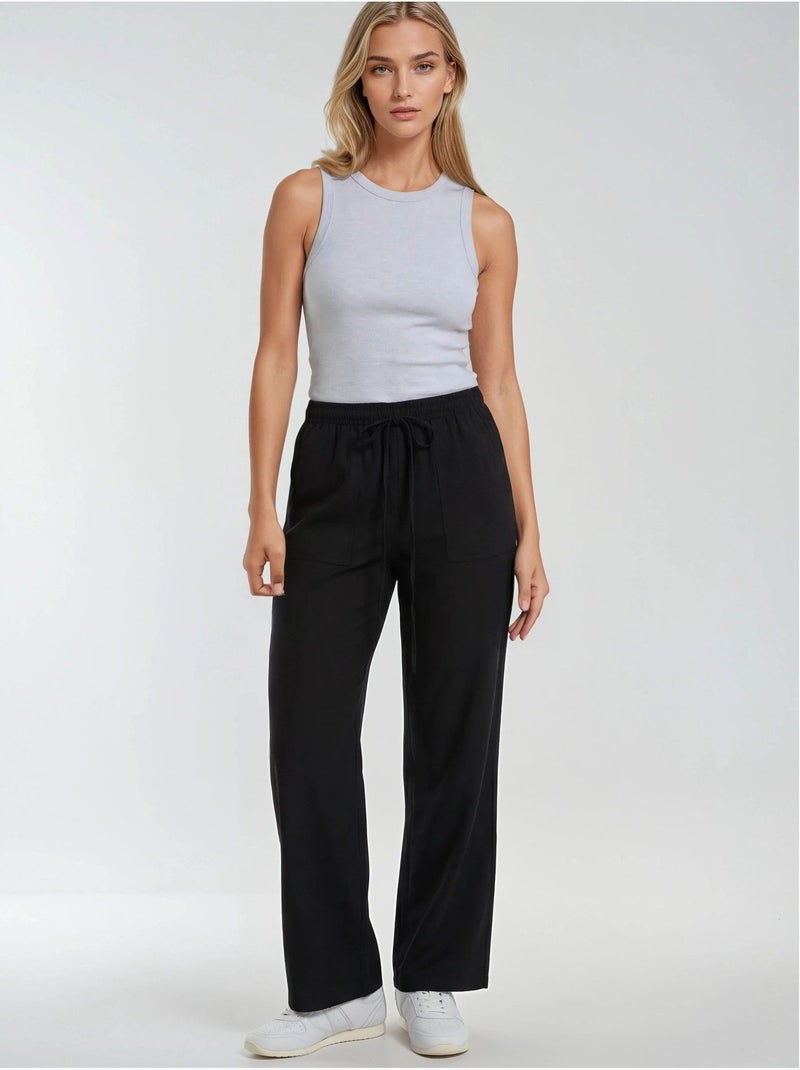 Pantalones largos de pierna recta con cintura elástica para mujer mixray Negro - Kiabi