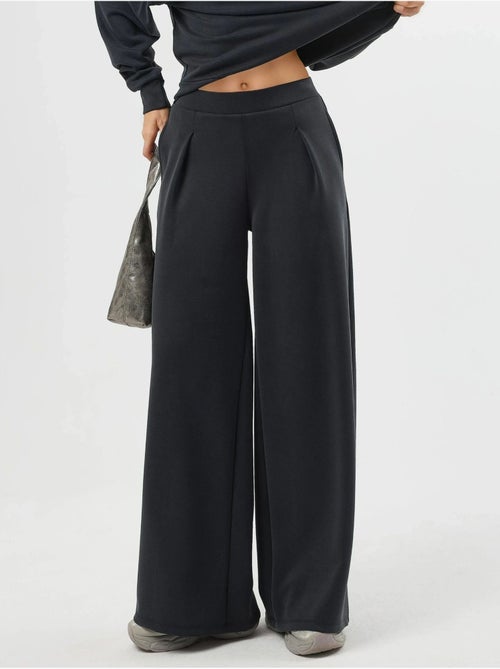 Pantalones palazzo de cintura alta con elástico busem - Kiabi Pantalones palazzo de cintura alta con elástico busem - Kiabi