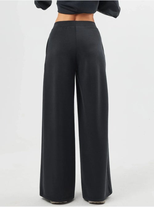 Pantalones palazzo de cintura alta con elástico busem - Kiabi Pantalones palazzo de cintura alta con elástico busem - Kiabi