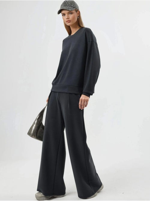 Pantalones palazzo de cintura alta con elástico busem - Kiabi Pantalones palazzo de cintura alta con elástico busem - Kiabi