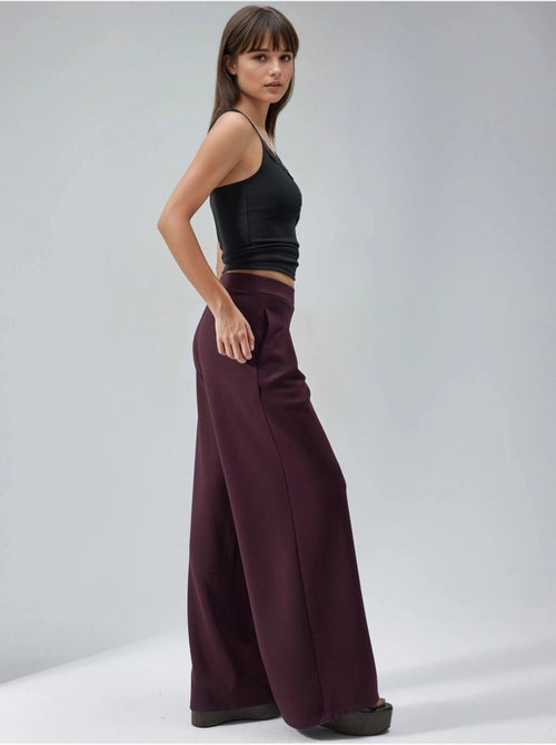 Pantalones palazzo de cintura alta con elástico busem - Kiabi Pantalones palazzo de cintura alta con elástico busem - Kiabi