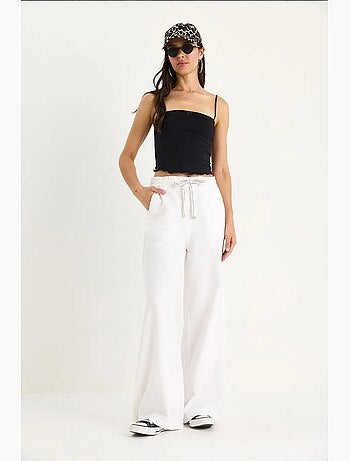 Pantalones palazzo de lino con cintura elástica y bolsillos detallados de bianco lucci