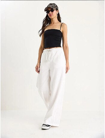Pantalones palazzo de lino con cintura elástica y bolsillos detallados de bianco lucci
