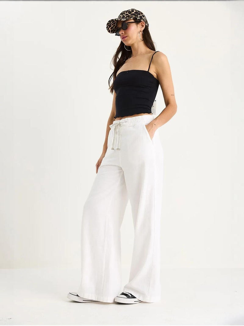 Pantalones palazzo de lino con cintura elástica y bolsillos detallados de bianco lucci Blanco - Kiabi