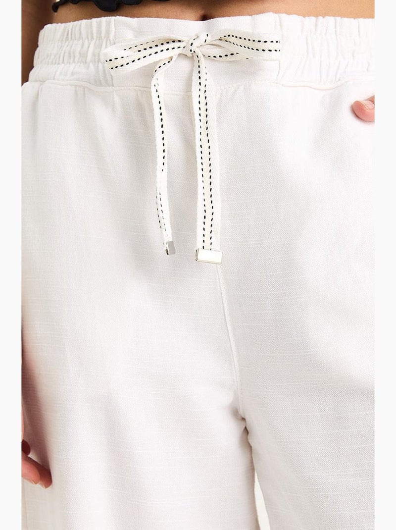 Pantalones palazzo de lino con cintura elástica y bolsillos detallados de bianco lucci Blanco - Kiabi