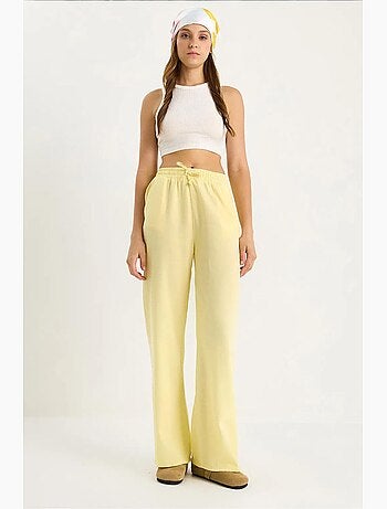 Pantalones palazzo de lino con cintura elástica y detalle de bolsillos de bianco lucci