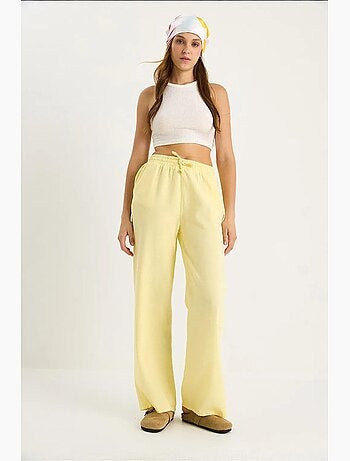 Pantalones palazzo de lino con cintura elástica y detalle de bolsillos de bianco lucci