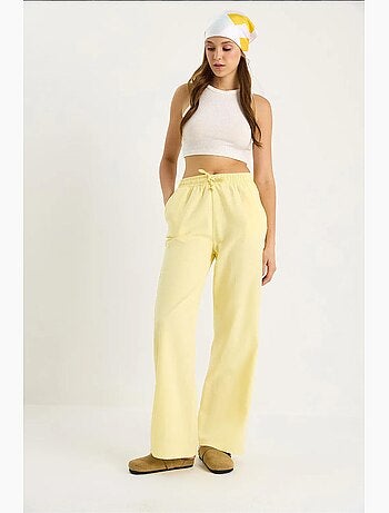 Pantalones palazzo de lino con cintura elástica y detalle de bolsillos de bianco lucci