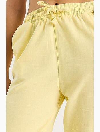 Pantalones palazzo de lino con cintura elástica y detalle de bolsillos de bianco lucci