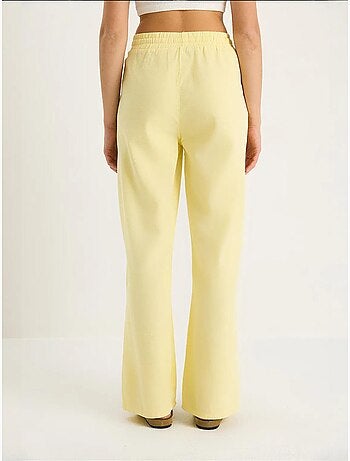 Pantalones palazzo de lino con cintura elástica y detalle de bolsillos de bianco lucci