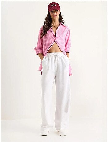 Pantalones palazzo de lino con cintura elástica y detalle de bolsillos de bianco lucci