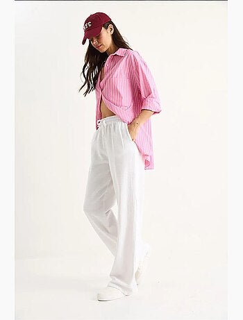 Pantalones palazzo de lino con cintura elástica y detalle de bolsillos de bianco lucci
