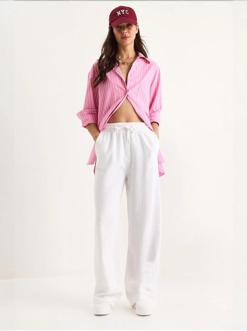 Pantalones palazzo de lino con cintura elástica y detalle de bolsillos de bianco lucci - Kiabi Pantalones palazzo de lino con cintura elástica y detalle de bolsillos de bianco lucci - Kiabi