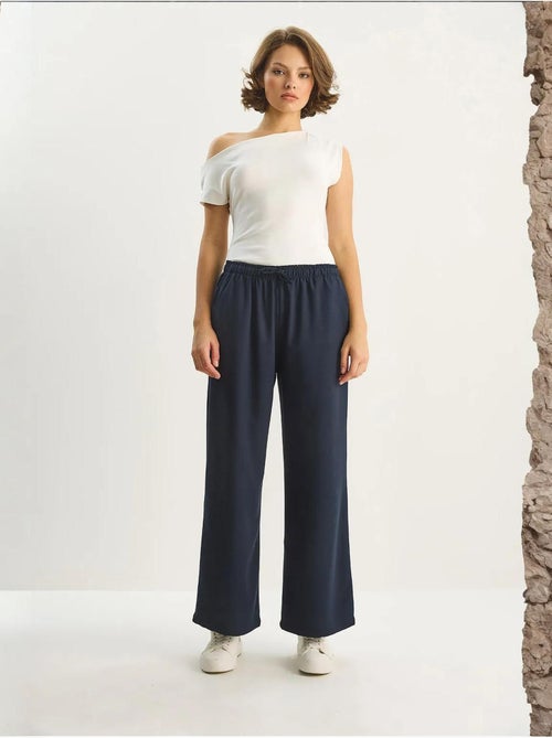 Pantalones palazzo de pierna ancha con cierre de lazo lucci - Kiabi Pantalones palazzo de pierna ancha con cierre de lazo lucci - Kiabi