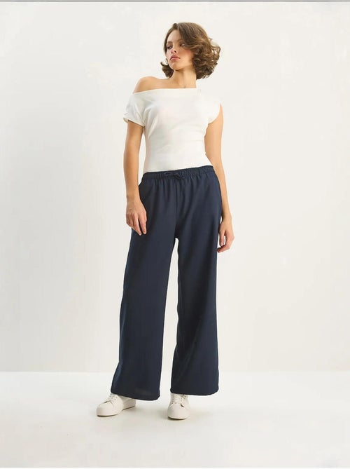 Pantalones palazzo de pierna ancha con cierre de lazo lucci - Kiabi Pantalones palazzo de pierna ancha con cierre de lazo lucci - Kiabi