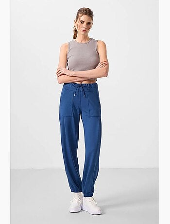 Pantalones relaxed de crepé de tiro medio con bolsillo tommy