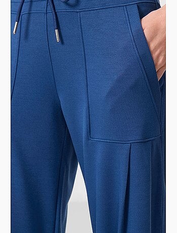 Pantalones relaxed de crepé de tiro medio con bolsillo tommy