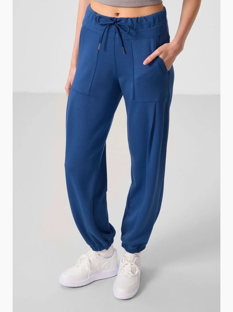 Pantalones relaxed de crepé de tiro medio con bolsillo tommy Azul - Kiabi