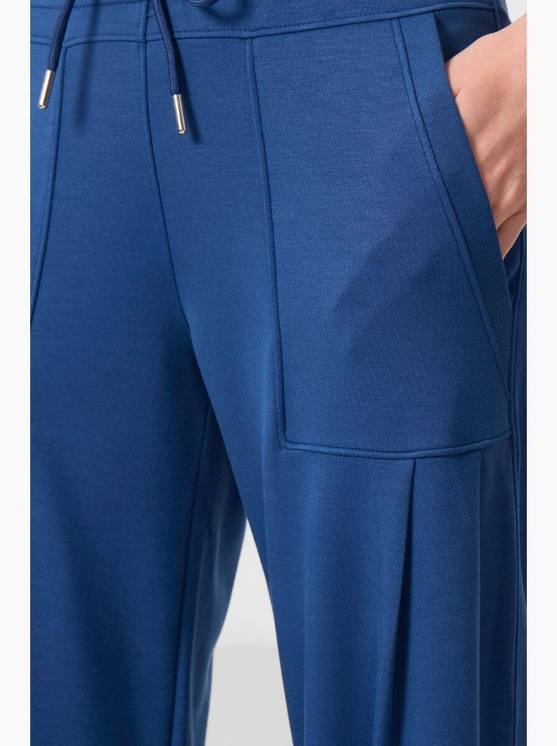 Pantalones relaxed de crepé de tiro medio con bolsillo tommy Azul - Kiabi