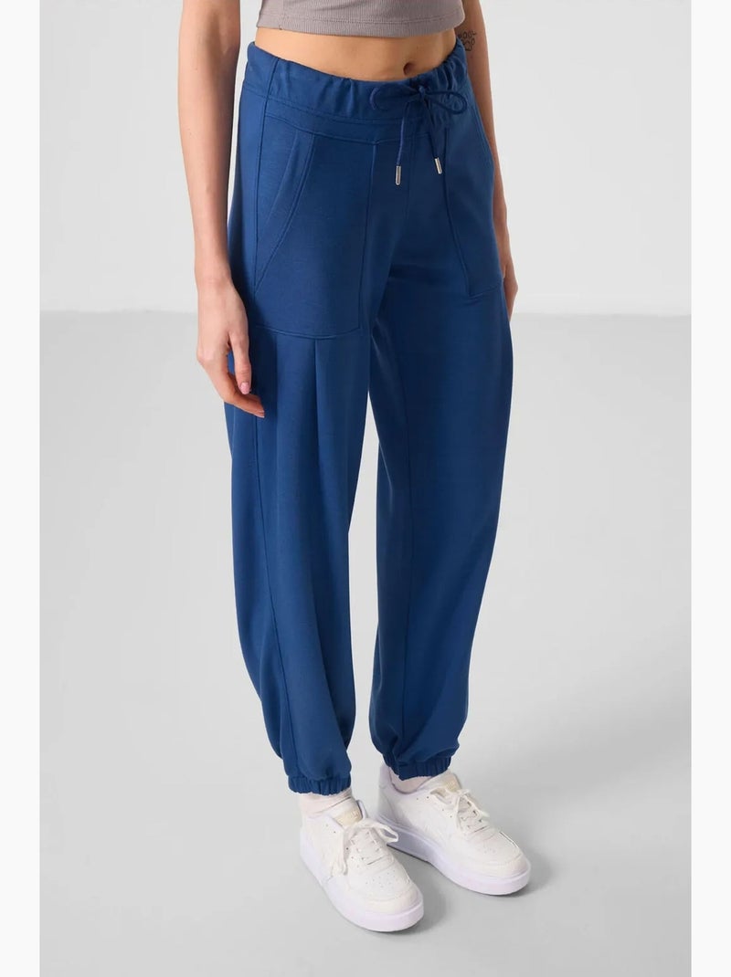 Pantalones relaxed de crepé de tiro medio con bolsillo tommy Azul - Kiabi