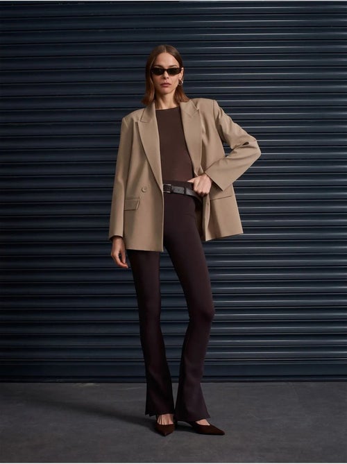 Pantalones skinny acampanados con cinturón - Kiabi