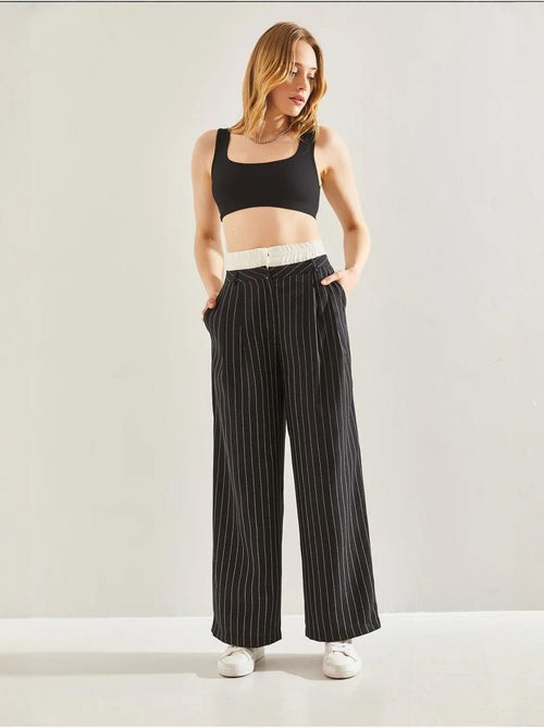 Pantalones tejidos a rayas con detalle en la cintura en contraste lucci - Kiabi Pantalones tejidos a rayas con detalle en la cintura en contraste lucci - Kiabi
