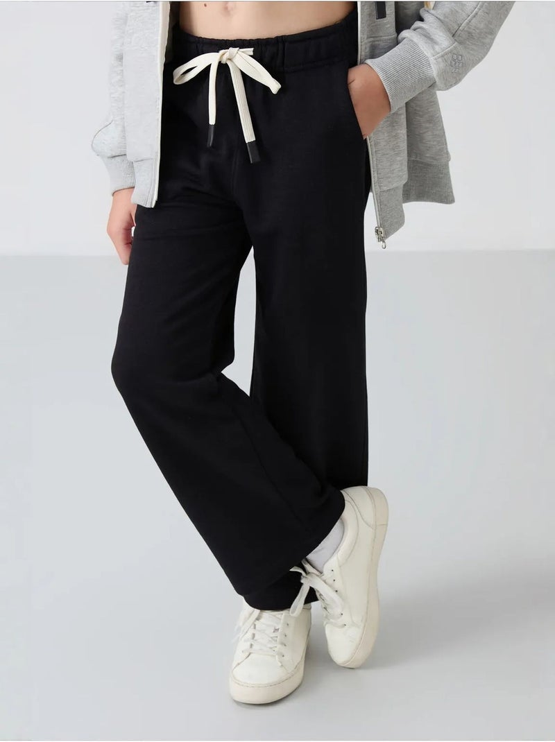 Pantalones youth de algodón y poliéster tommy Negro - Kiabi